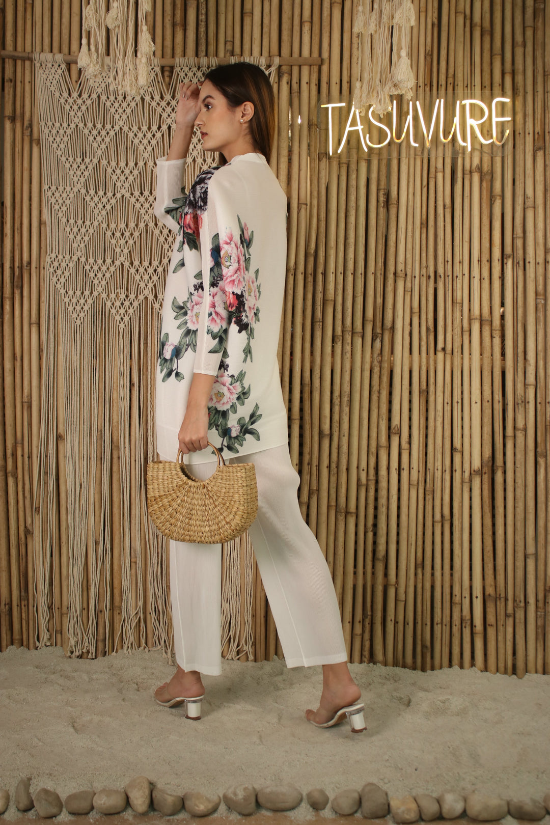 The floral shirt comes with center front button closure, dolman sleeves and an ankle length pleated pants.