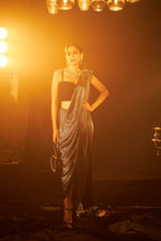 Load image into Gallery viewer, Saia metallic slit saree with an embellished pearl blouse will definitely make you look sassy and elegant in an event.  Tailored to perfection in a metallic fabric, the saree features a slit from the waist level and has an attached palla which creates a great fall.  It comes with a pearl embellished blouse with dori attachments on the back.